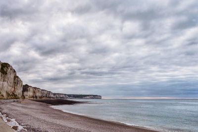 Scenic view of sea against cloudy sky