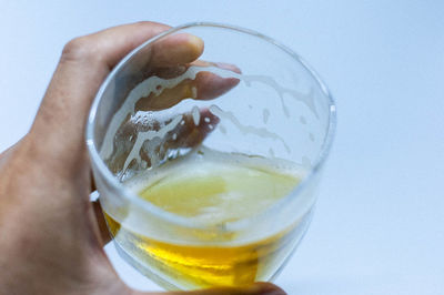 Close-up of hand holding drink