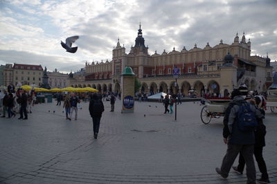 People in front of historical building