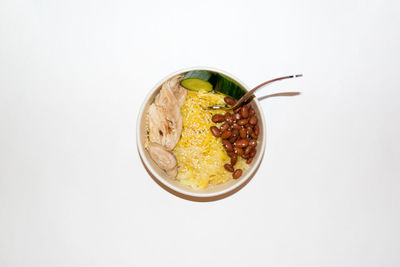 Directly above shot of food in bowl against white background