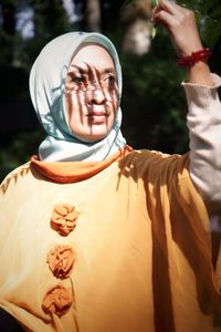 Low angle view of woman wearing mask