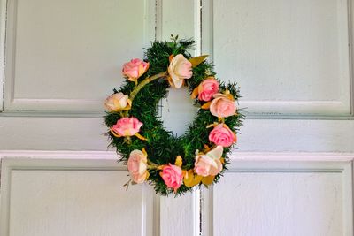 Close-up of pink flower pot against wall