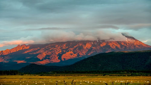 Idyllic shot of mountain against cloudy sky