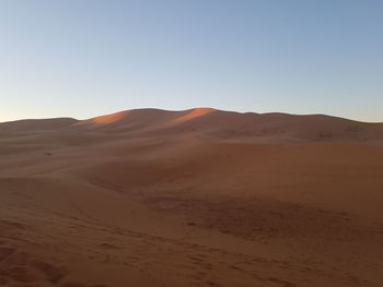 Scenic view of desert against clear sky