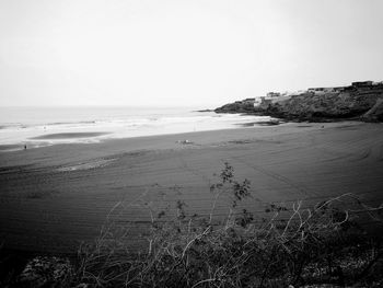 Scenic view of beach against clear sky