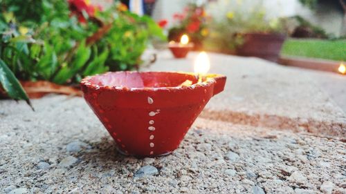 Close-up of lit tea light on table
