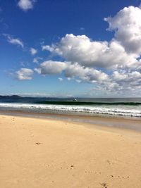 Scenic view of beach against sky