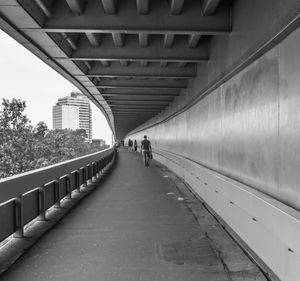 People walking on footbridge