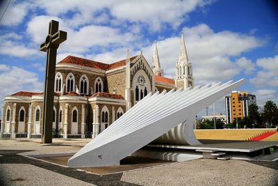 Low angle view of church against cloudy sky