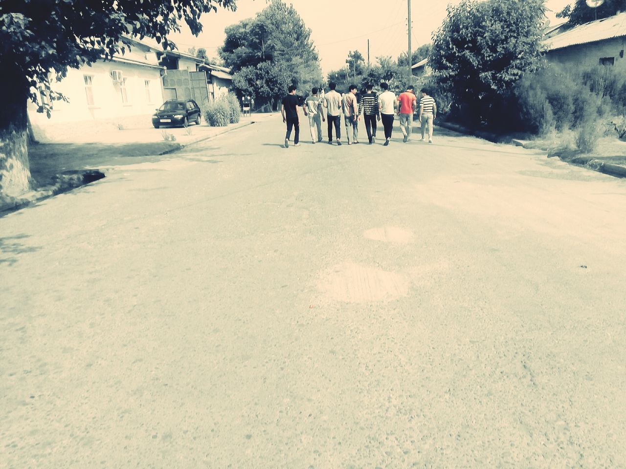 PEOPLE WALKING ON ROAD