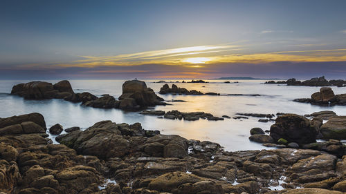 Scenic view of sea against sky during sunset