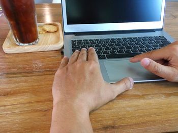 Midsection of man using mobile phone