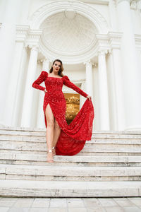 Young woman sitting on staircase