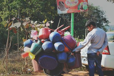 Man wearing mask against trees