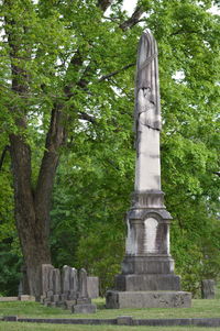 Statue of woman in park