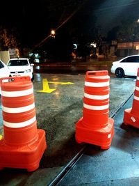 Red umbrella on road at night