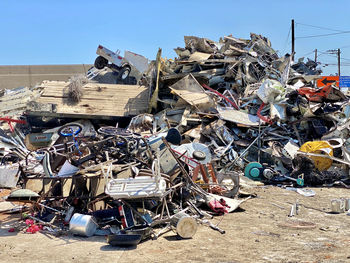 Garbage on metal structure against sky