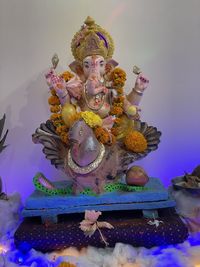 Statue of temple against building