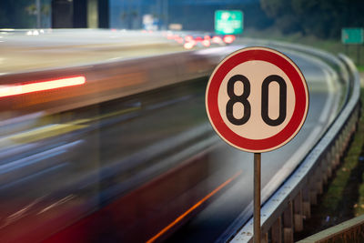 Blurred motion of car on road at night