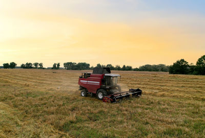 Tractor on field against sky