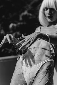 Close-up portrait of woman holding umbrella