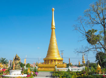 View of temple against building