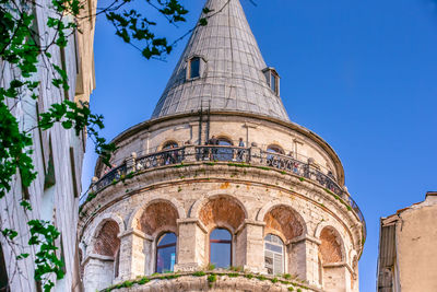 Low angle view of historical building against clear blue sky