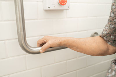 Midsection of man in bathroom