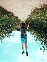 Full length of young man against plants