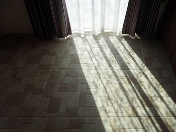 Shadow of sunlight falling on floor at home