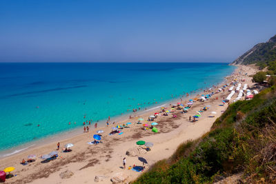 High angle view of people on beach against sky