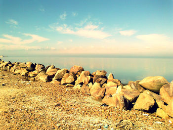 Rocks on shore against sky