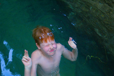 Boy swimming in sea