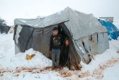 Syrian refugee children playing in the snow that fell on the camp near the syrian-turkish border.