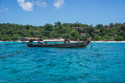 Scenic view of sea against blue sky