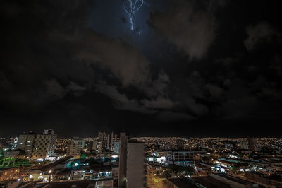 High angle view of illuminated buildings in city at night