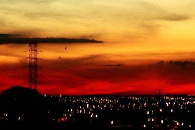 View of illuminated city at sunset