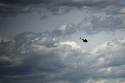 Low angle view of helicopter in sky