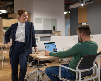 Side view of young man working in office