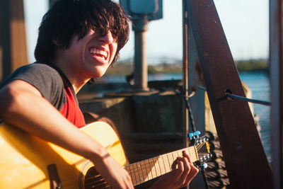 Young man playing guitar