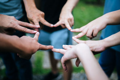 High angle view of people making star shape