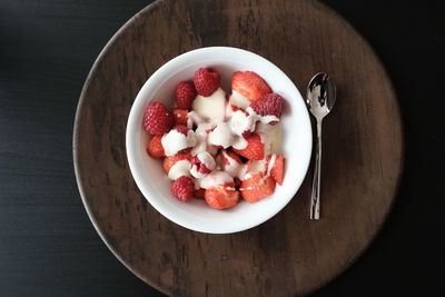 High angle view of chopped fruits in bowl on table