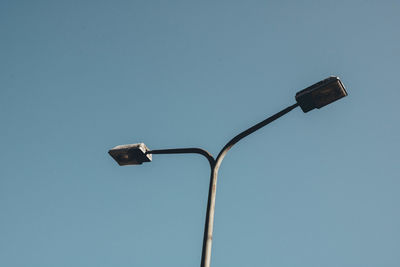 Low angle view of street light against clear sky