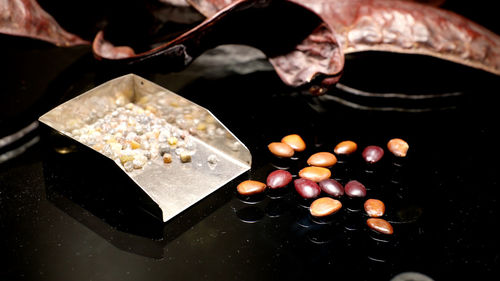 Close-up of wedding rings on table