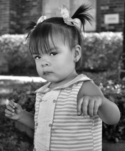 Portrait of cute girl standing outdoors