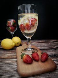 Fruits in glass on table