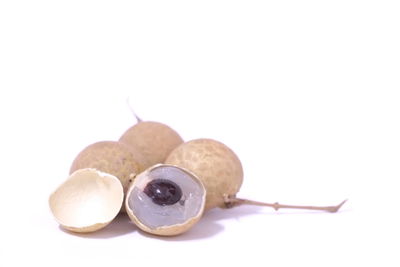 Close-up of fruit against white background