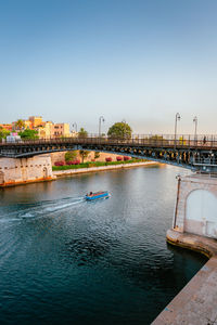 Bridge over river against clear sky