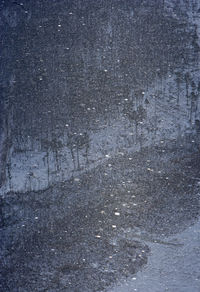 Full frame shot of snowflakes on road