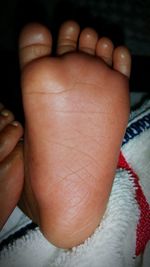 Cropped image of baby feet